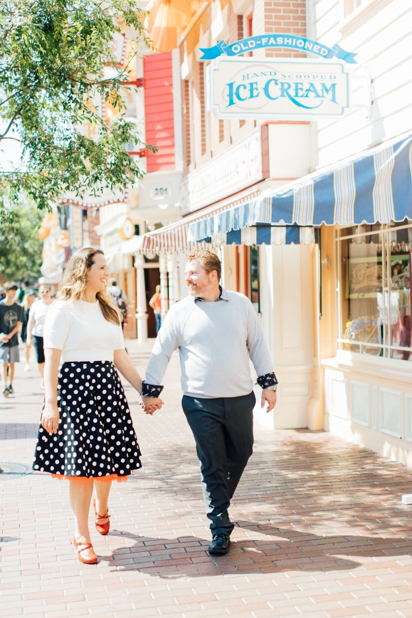 walking by ice cream on main st by by orange county wedding photographer