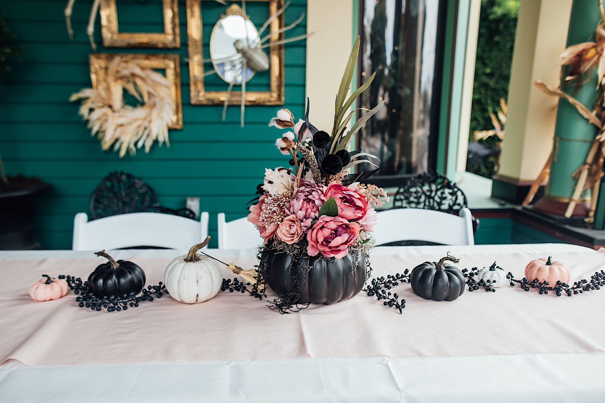 witch getting hitched bridal shower decor outside of victorian haunted mansion by photographer Jessica Sofranko