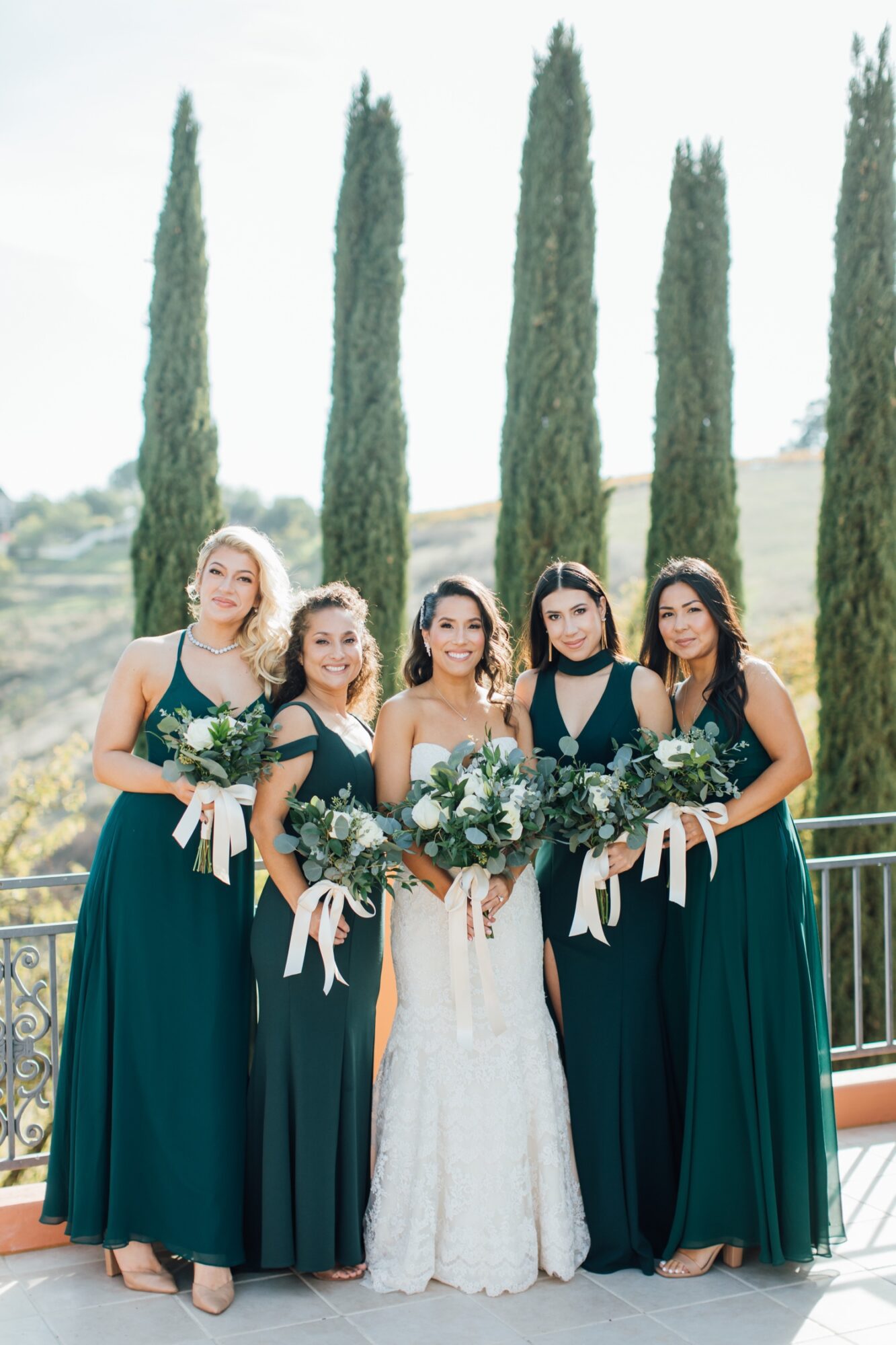 Bride smiling with her bridesmaids