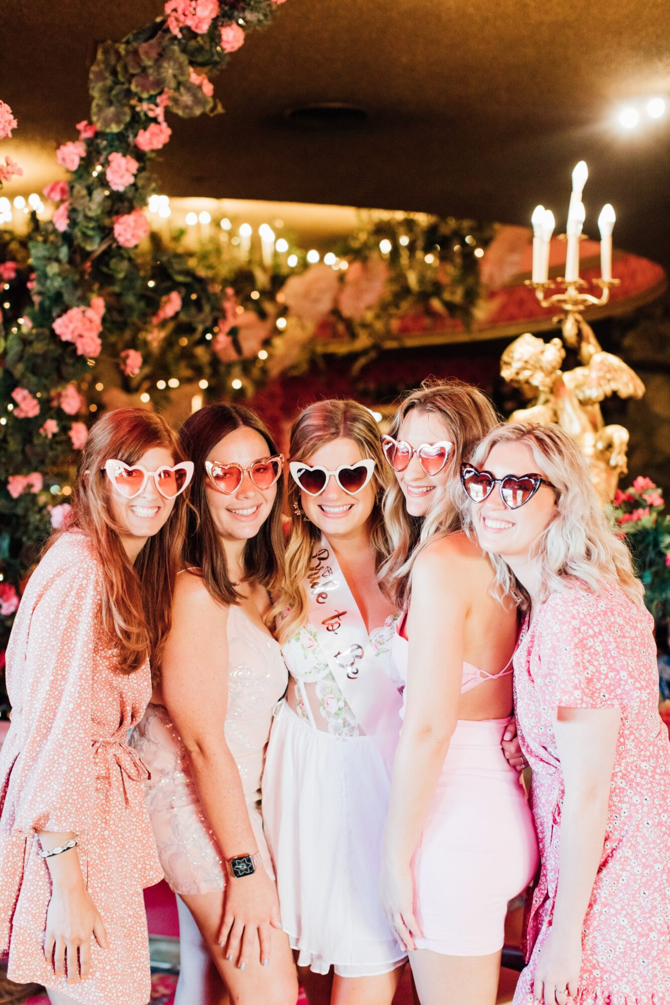 Photo of bride with her bridesmaids during bachelorette party at Madonna Inn Steakhouse celebrating before her wedding