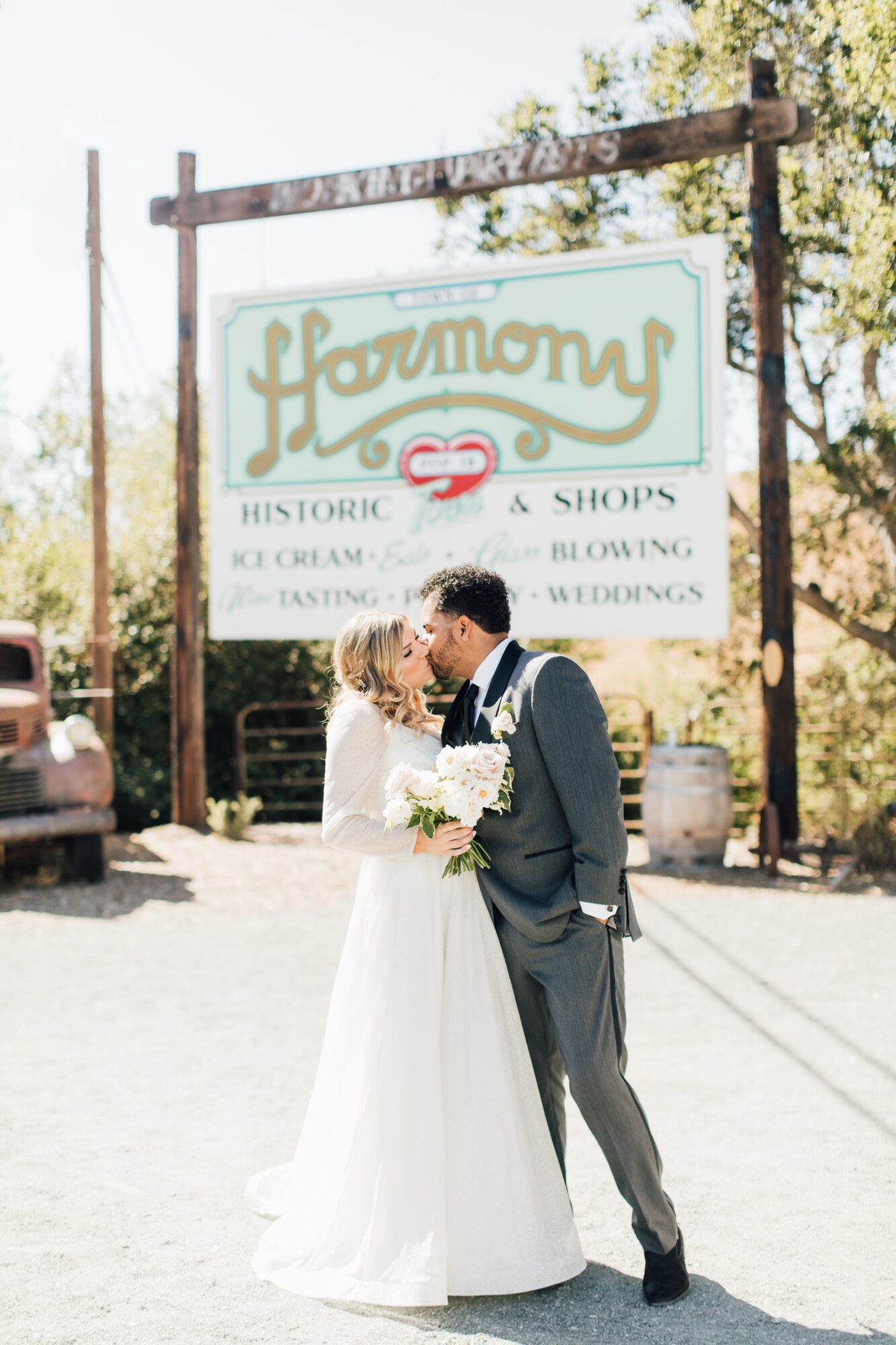 sign of the town of harmony with couple