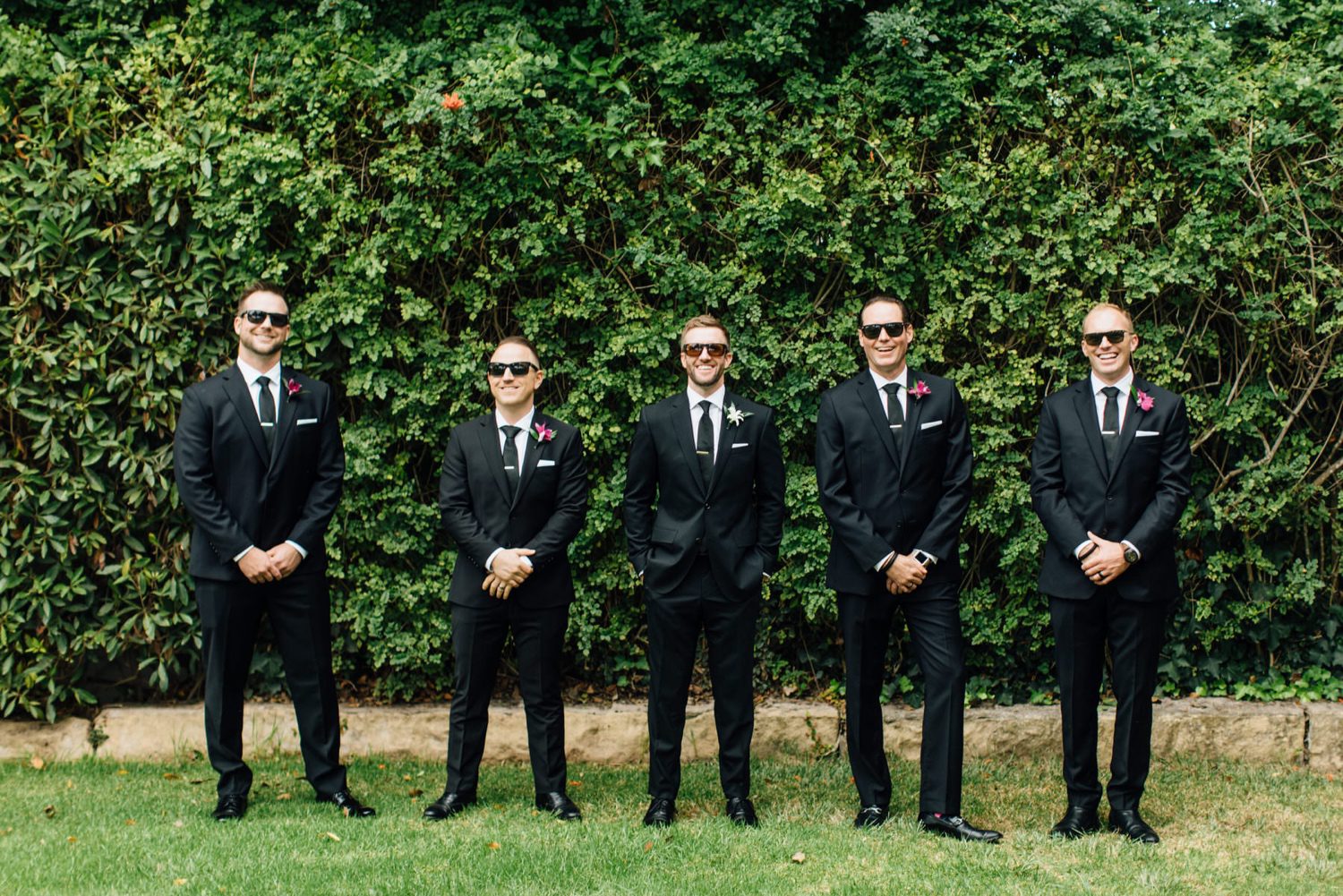 Groom and his groomsmen wearing sunglasses