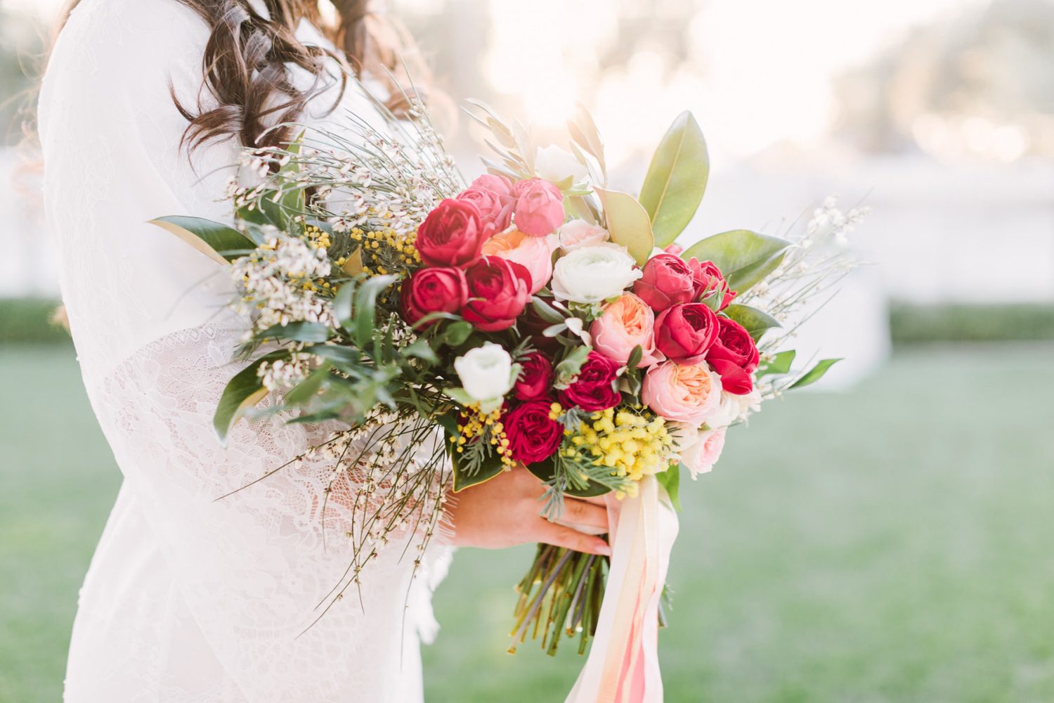 Bride holding colorful wedding bouquet