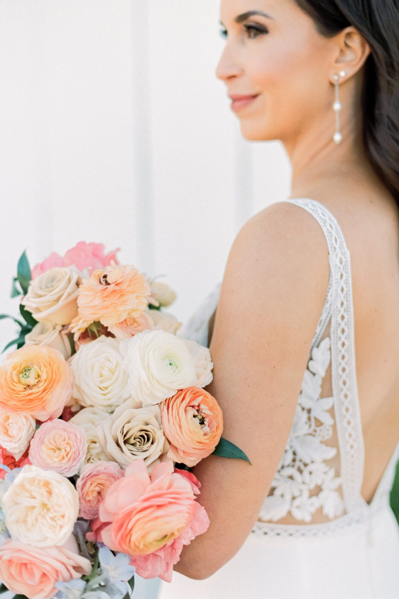 bride holding bouquet by Elegant Details at the White Barn Edna Valley photographed by san luis obispo wedding photographers jessica sofranko