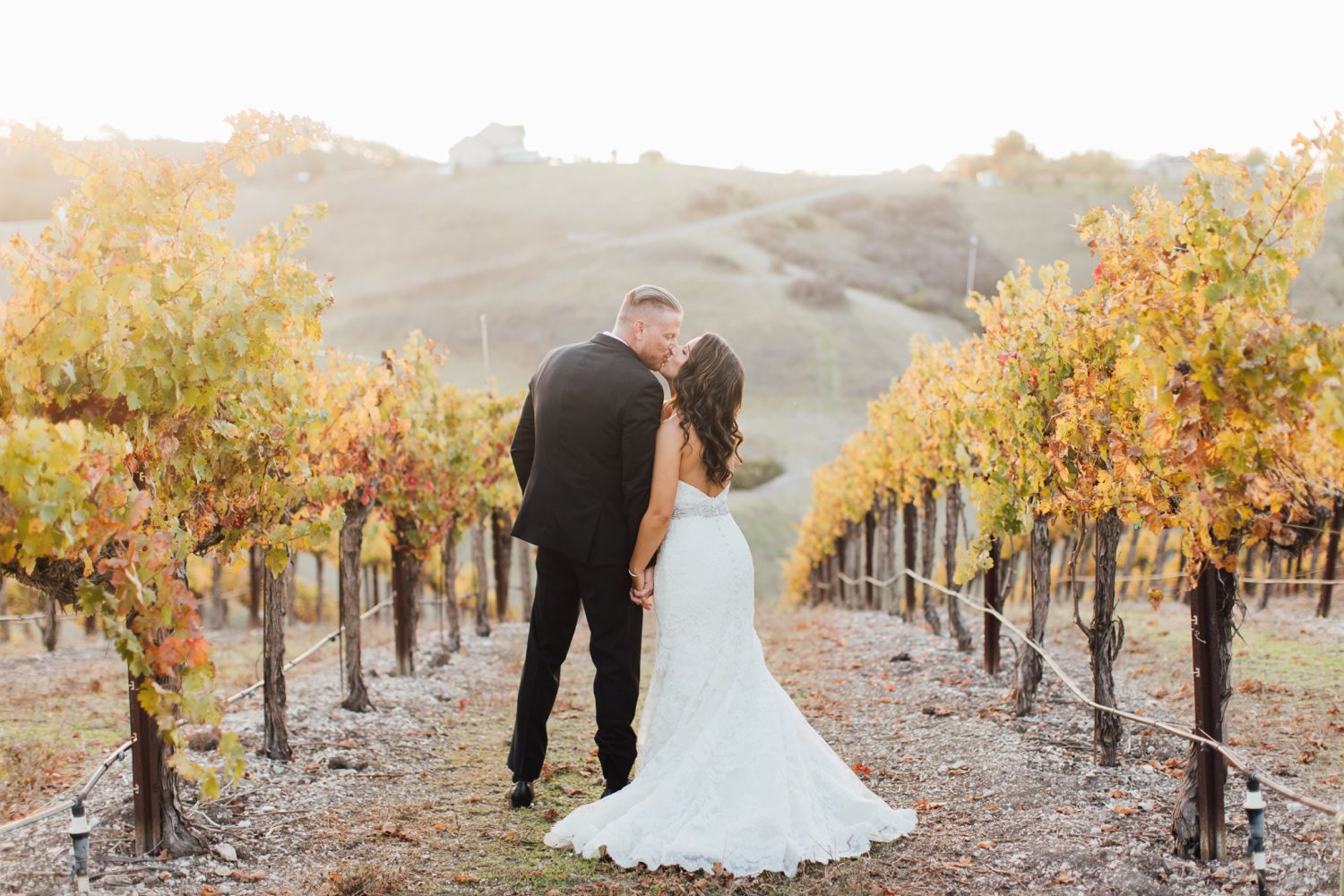 sunset photos of bride and groom at european chateau inspired wedding in Paso Robles by wine country photographer Jessica Sofranko
