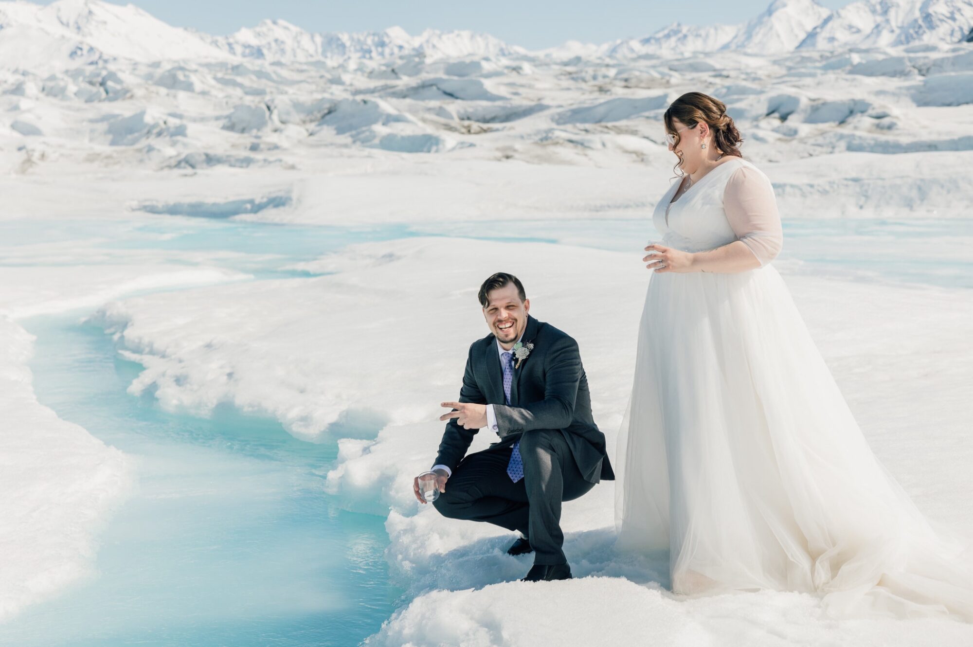 Bride & Groom during elopement on Knik Glacier by destination wedding photographer Jessica Sofranko