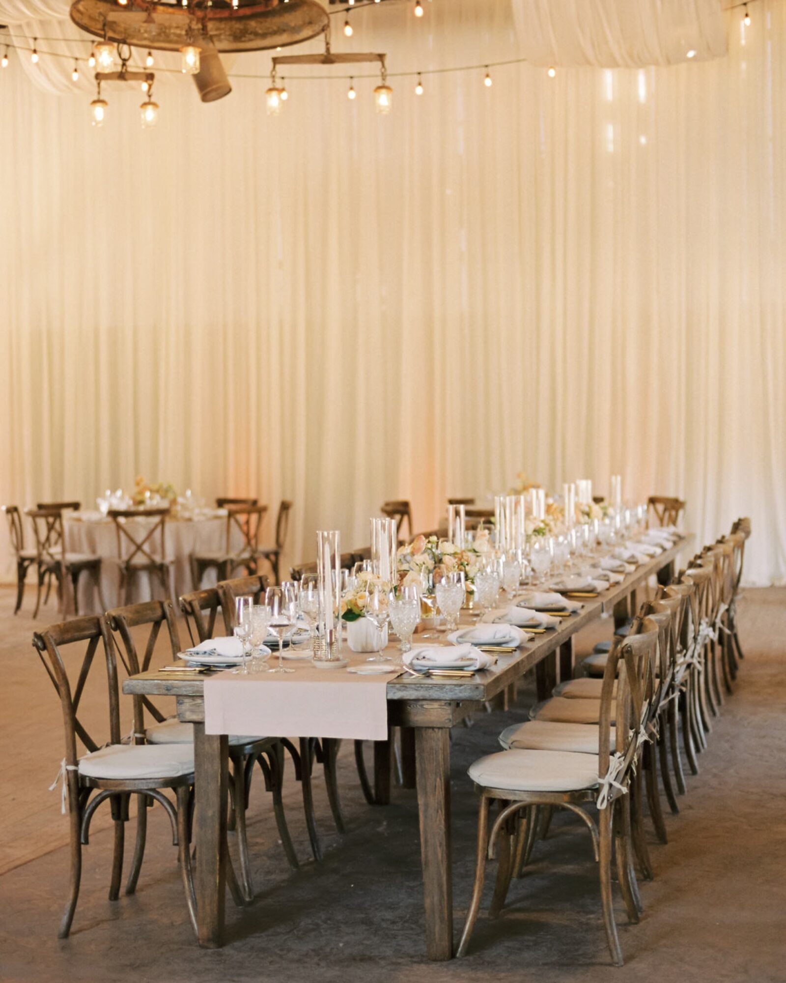 long wooden table for reception at at the White Barn Edna Valley photographed by san luis obispo wedding photographers jessica sofranko