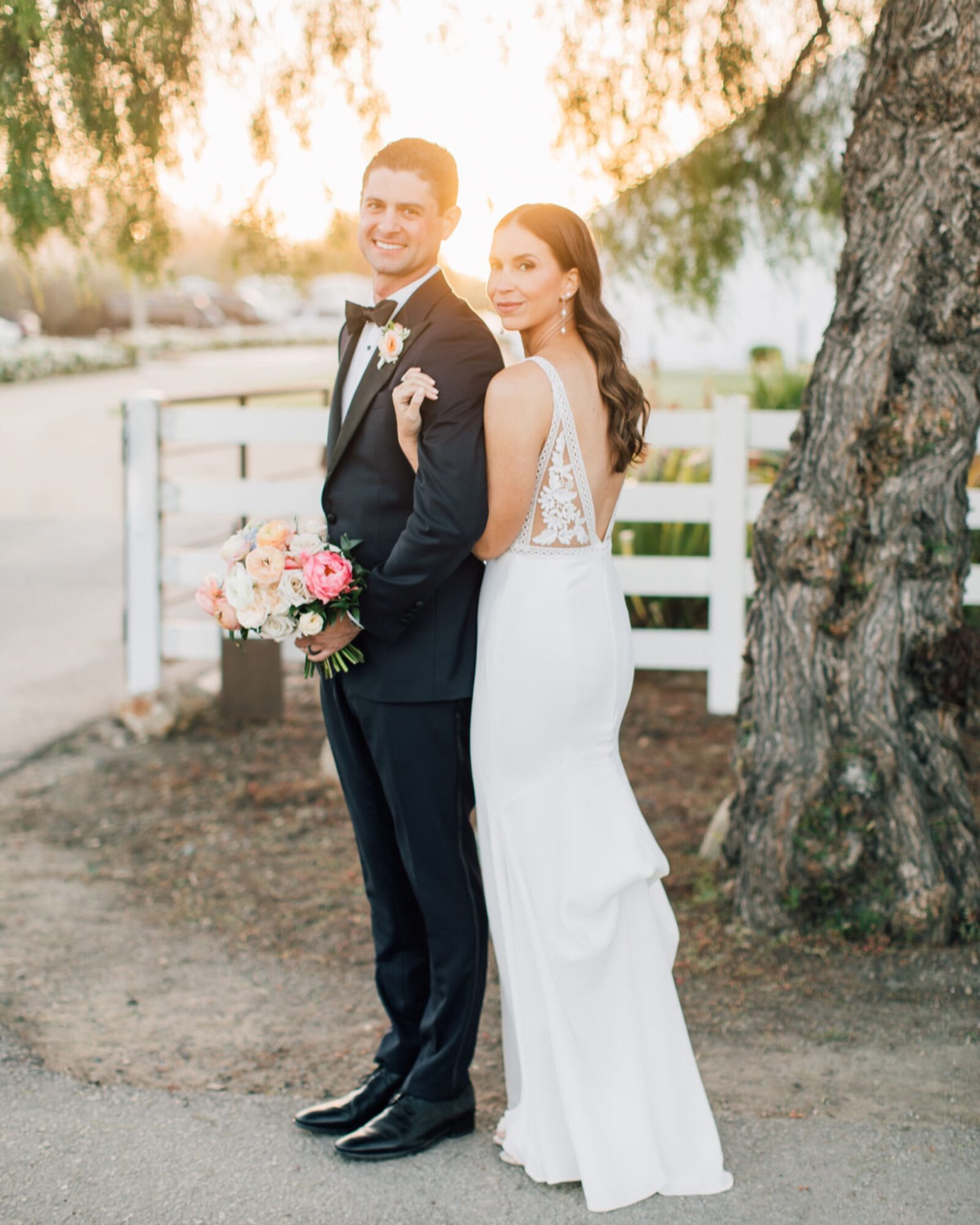 Bride and groom during sunset portraits at at the White Barn Edna Valley photographed by san luis obispo wedding photographers jessica sofranko