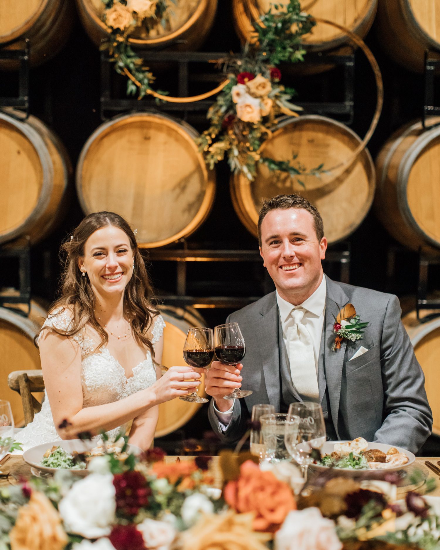 California bride and groom toasting wine