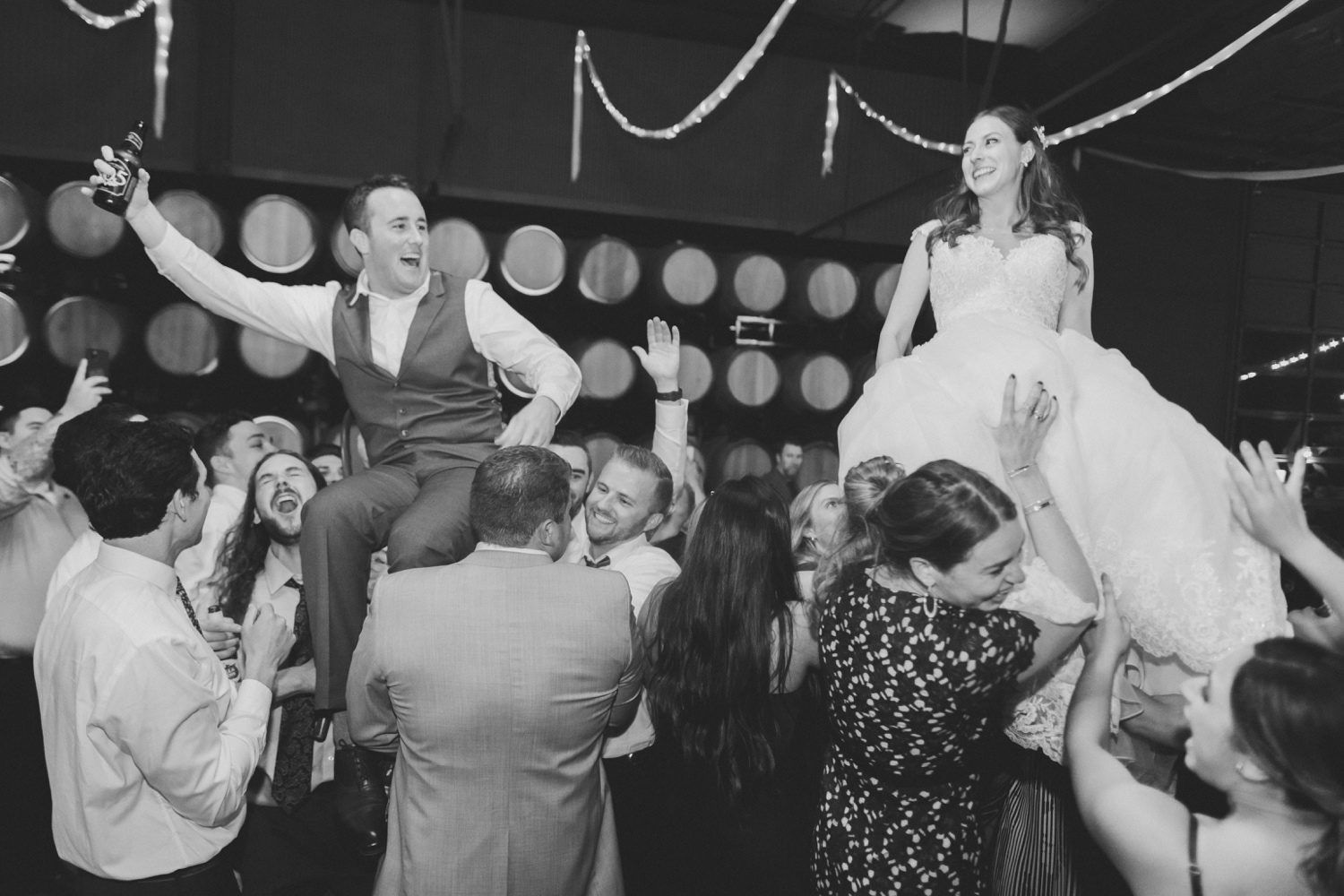 Bride and groom crowd surfing at Paso Robles Wedding
