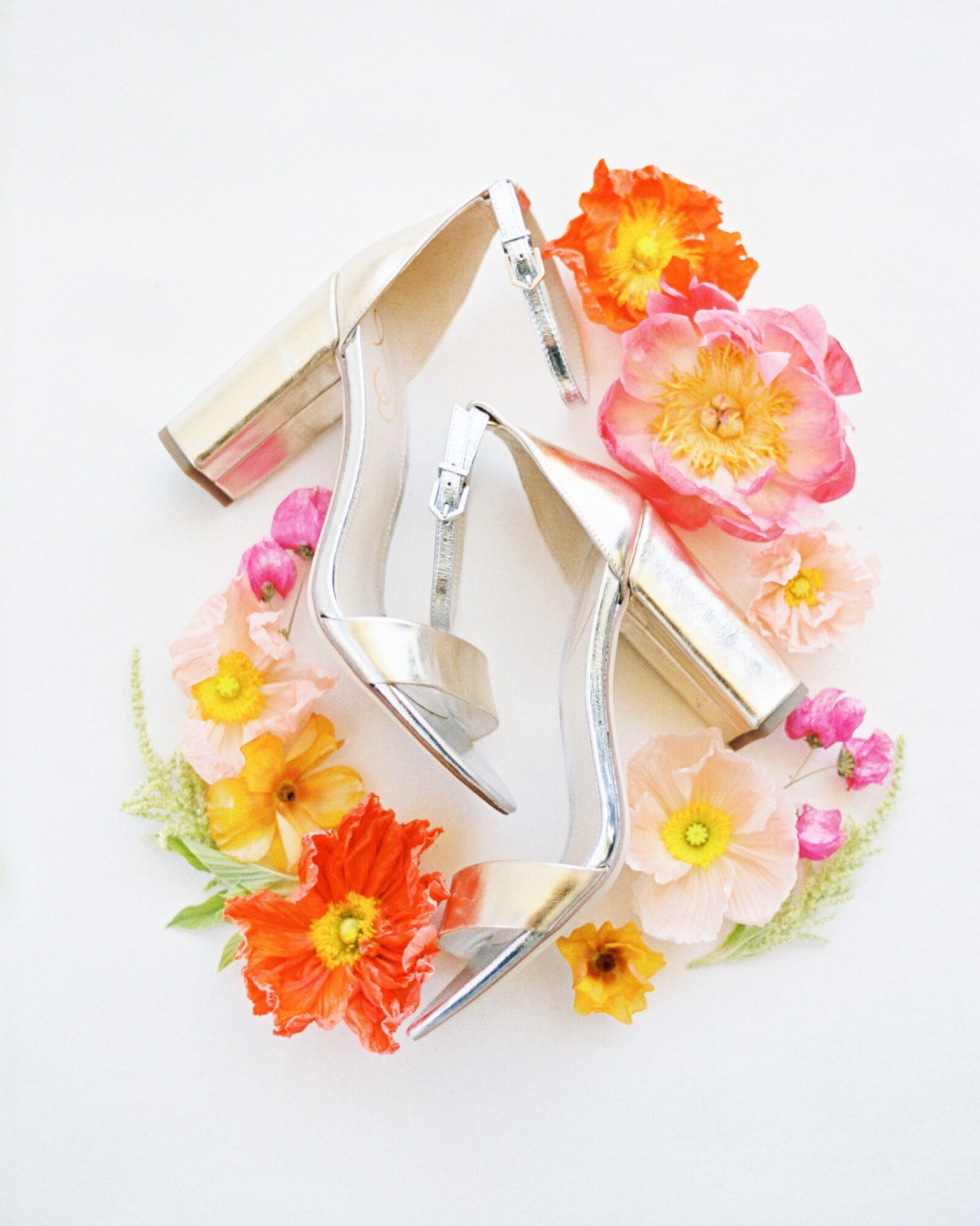 tropical florals decorating shoes at la lomita ranch in edna valley california by photographer Jessica Sofranko