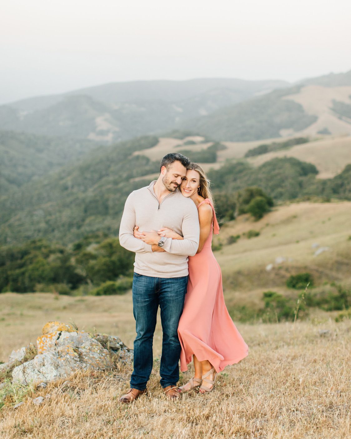 Best San Luis Obispo wedding venues landscape photo of couple cuddling on the Central Coast of California by luxury destination photographer Jessica Sofranko