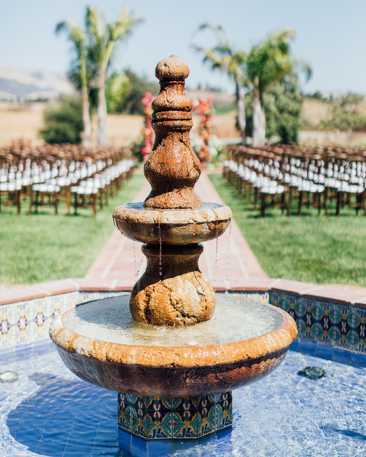 Best San Luis Obispo wedding venues La Lomita Ranch water fountain with spanish tile in front of ceremony site